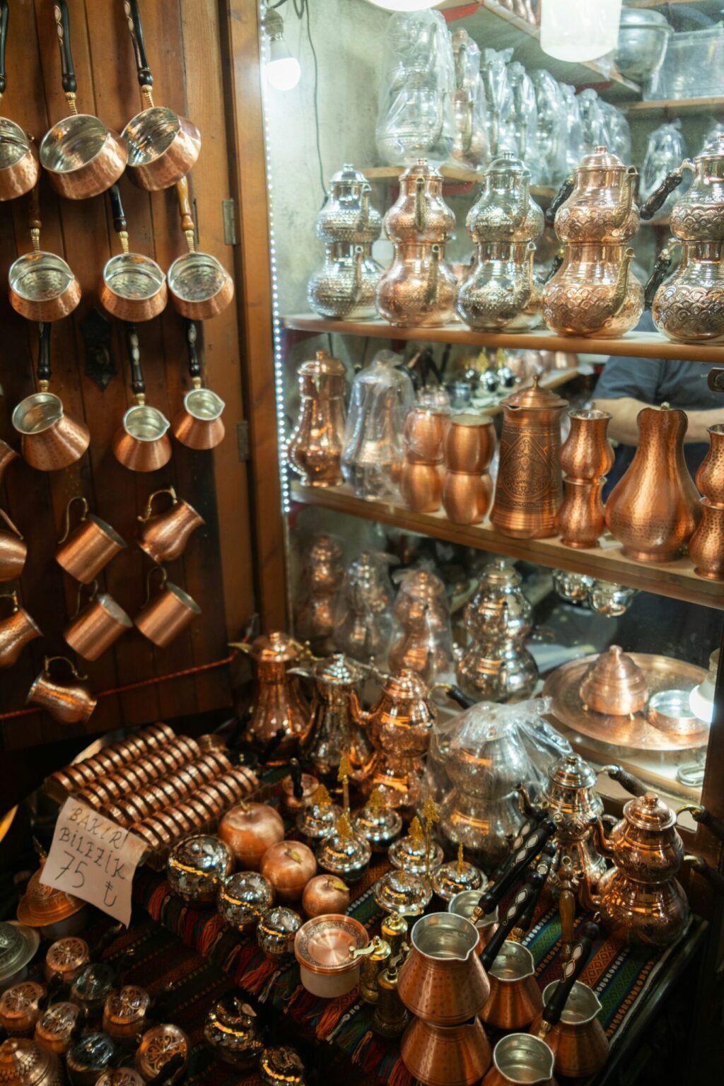 Shelves of copper and silver pieces
